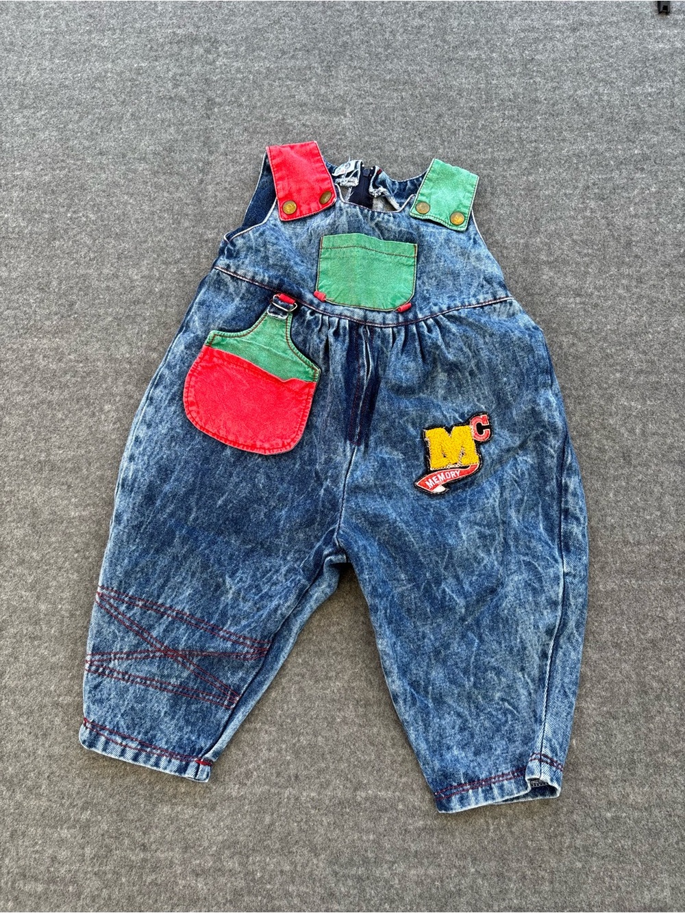 Vintage 90s denim overalls with red and green accents. Size: 2 years